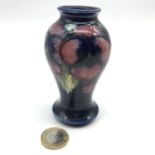 A 20th century small Pansy design Moorcroft vase. Measures 10cm in height