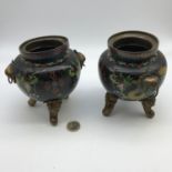 A Pair of early 20th century cloisonne pots, Sat upon three woo dogs heads as feet. designed with