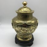 Antique heavy brass/ bronze Chinese/ Japanese preserve pot with lid, sat upon a hard wood stand,