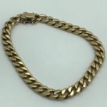 A 9ct gold Curb chain bracelet, Measures 21.5cm in length, weighs 15.39grams