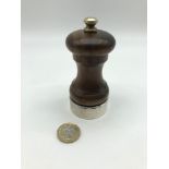 A vintage pepper mill with London silver collar, Maker M C Hersey & Son Ltd.