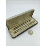 A Pair of Birmingham silver pens with carry case.