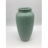 A Chinese Pale Celadon glazed vase. Measures 25cm in height