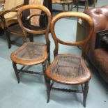 A Pair of Victorian balloon back chairs with bergere seat area.