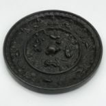 Ancient Chinese bronze mirror, depicting various animal figures, vines and foliage. Measures 10cm in