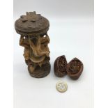 Hand carved figure of Hindu god Ganesha together with hand carved nut concealing two Hindu