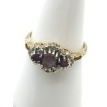 A 9ct gold ladies Diamond and 3 stone Amethyst stone ring. Ring size L, Weighs 1.65grams