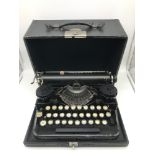 A Vintage Underwood standard portable typewriter with fitted travel case.