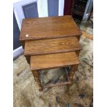 A Nest of 3 oak tables.