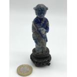 Antique hand carved oriental girl figure, carved from a blue hard stone and sat upon a carved