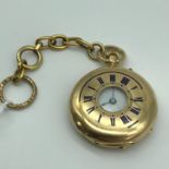 An 18ct gold pocket watch with gold hoop chain, In a running condition,chain weighs 5.80grams and