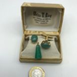 A Pair of 14k gold & jade Singapore cuff links together with jade carved pendant. Cuff links weigh