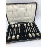 A Boxed set of Birmingham silver tea spoons with sugar tongs, Maker Docker & Burn Ltd, Dated 1926.