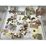 A Lot of mixed world coins and bank notes which includes a set of 3 consecutive one dollar bank