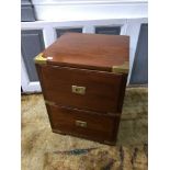 A Reproduction solid wood two drawer campaign chest, fitted with brass corner and line inlays,