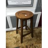 An Antique Solid oak pedestal stool.