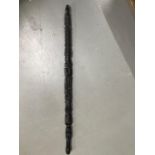 An Ebony African carved totem style walking stick. Measures 80cm in length