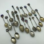 A Lot of 18 Silver & enamel Souvenir spoons, All hall marked. Weighs 230grams in total.