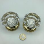 A Pair of antique brass and crystal door knobs