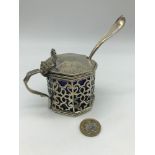 A Victorian London silver pierced condiment pot, fitted with original blue liner, Together with a