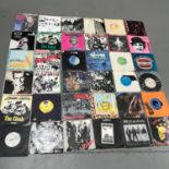 A Collection of Punk 45rpm records which includes The Clash, Public Image, The Partisans, The