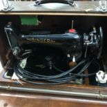 Singer sewing machine within a fitted travel case.