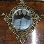 Antique gilt brass heavy ornate framed bevel edge mirror, Measures 52x39cm