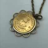 A 1/10 Oz gold Krugerrand dated 1981, fitted in a gold pendant casing and a 9ct gold chain, Chain