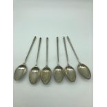 A Set of six 800 grade silver tea spoons.