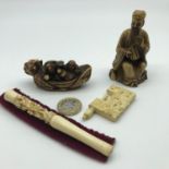 An Ivory carved Chinese floral design cheroot, Netsuke figure depicting Drunk Japanese fisher men,