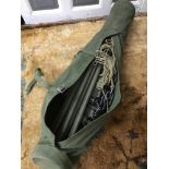 A Military equipment carry bag with contents possibly a hammock