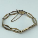 An unusual 9ct gold ladies bracelet, Maker S & P. weighs 10.57grams