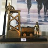 Coal Miner Brass figurine and structure on a hardwood stand, Measures 27cm in height