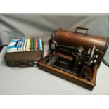 A singer sewing machine together with a cased typewriter (locked)
