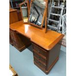 Charles Barr Furniture Knee hole dressing table fitted with 6 drawers and a 3 way mirror. Comes with