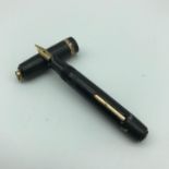 A Small Golden Arrow fountain pen, Fitted with a 14ct gold nib.