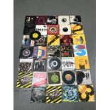 A Collection of mixed genre 45rpm's includes Bad Manners, Fine Young Cannibals, Cockney Rejects, U.K