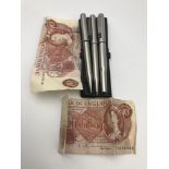 Three vintage Parker pens and Two Bank of England Ten Shillings notes.