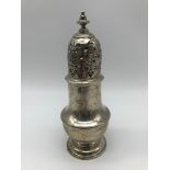 A Georgian London silver sugar shaker, dated 1736, Weighs 216grams, Measures 17.5cm in height