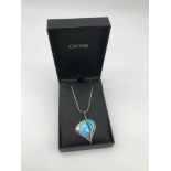 An Ortak silver and enamel celtic design pendant with silver chain, certificate and box.