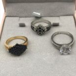 A Lot of two silver and gem stone rings together with silver gilt and gem stone ring.