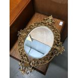 Antique solid gilt brass ornate framed mirror. Measures 52x39cm