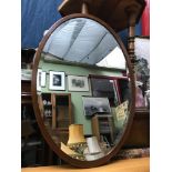 An Oval Edwardian framed bevel edge mirror, Measures 80x55cm