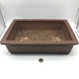 A Late 20th century bonsai tree clay rectangular planter with Zhong Guo Yixing impressed mark to the