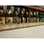 A cased display of vintage beer bottles