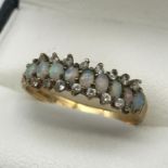 A Ladies 9ct gold opal and cz stone ring, ring size Q 1/2, Weighs 2.06 grams