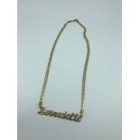 A 14ct gold necklace and name pendant 'Bernadette' weighs 14.06 grams