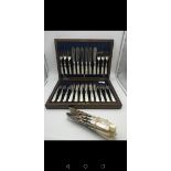 A boxed set of mother of pearl handled fish cutlery together with various other mother of pearl