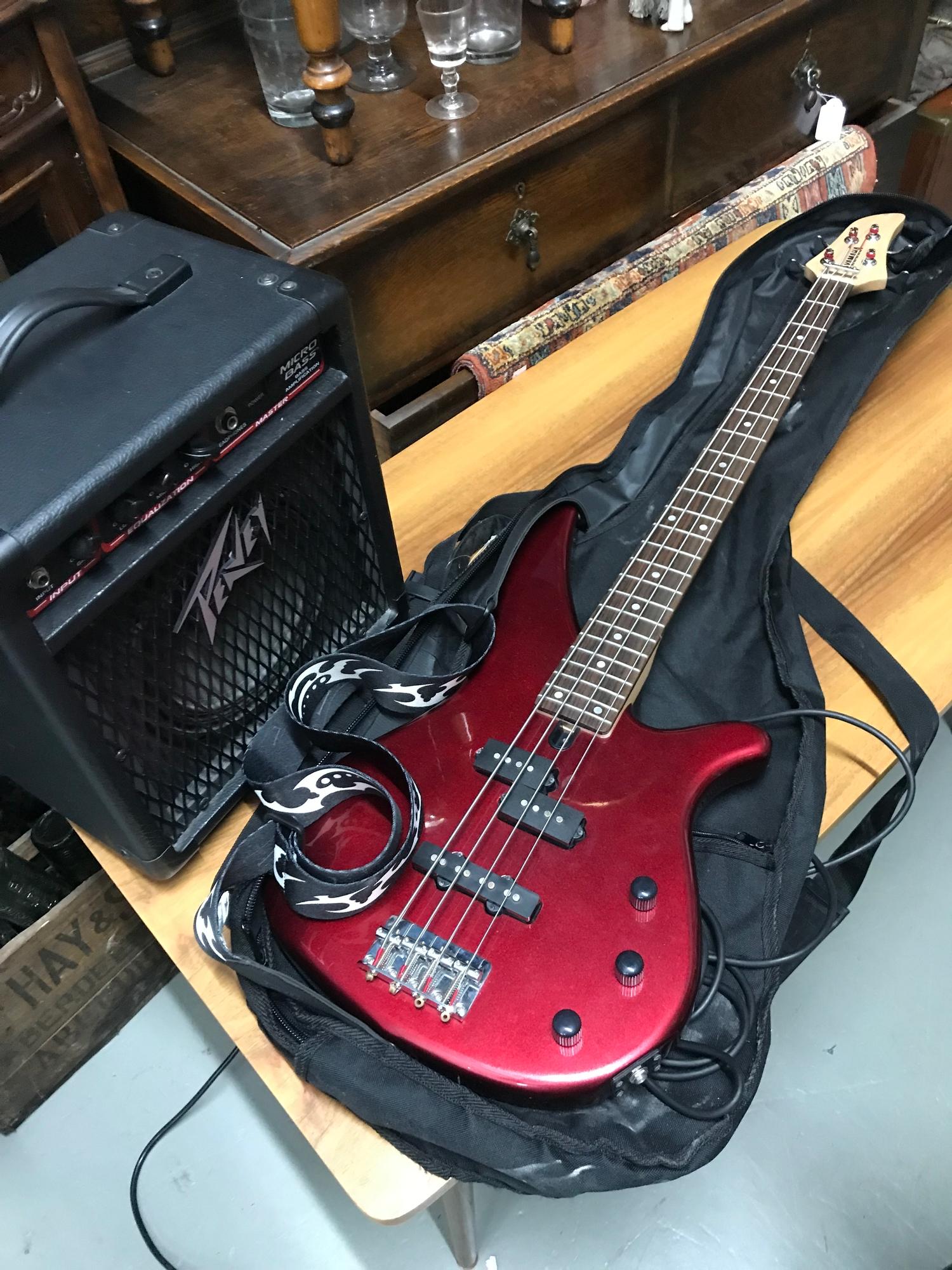 Yamaha Bass Guitar together with Peavey amplifier.