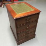 A Reproduction two drawer file cabinet finished with a green leather top, Comes with two keys,